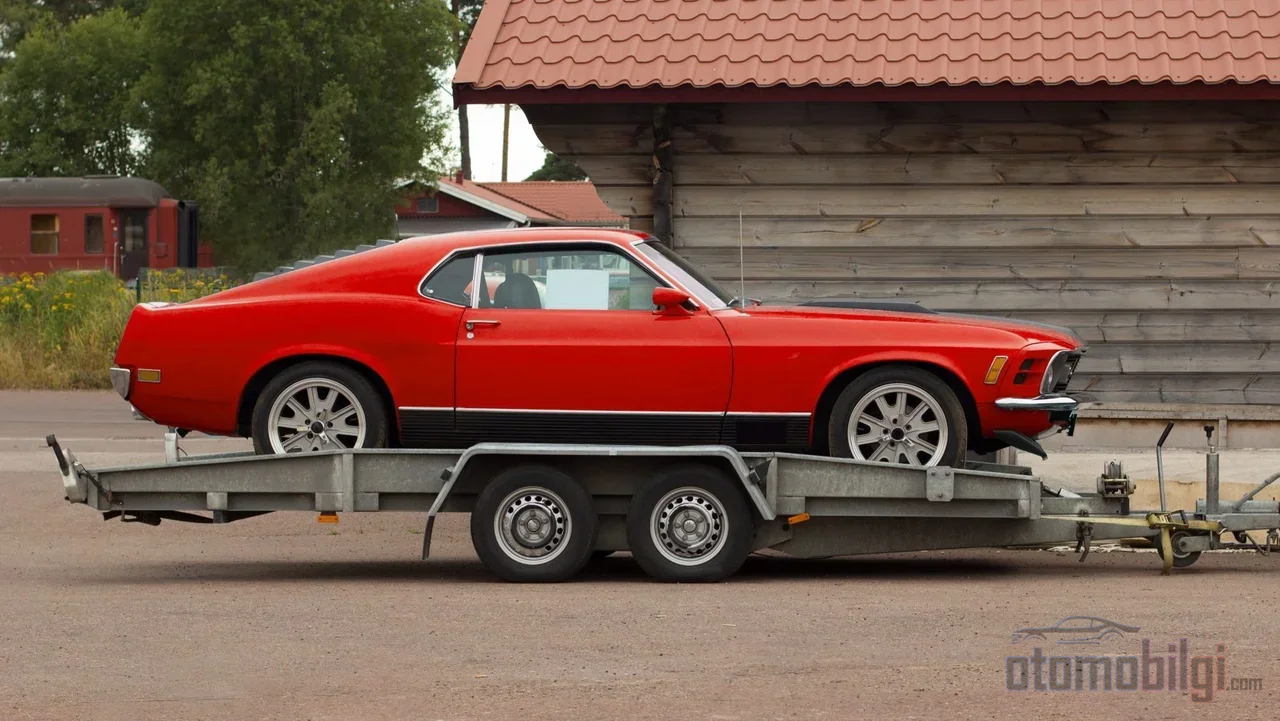 With an enclosed trailer, soft straps, and the insurance payout limit known, a classic car can travel between continents with the same confidence.
