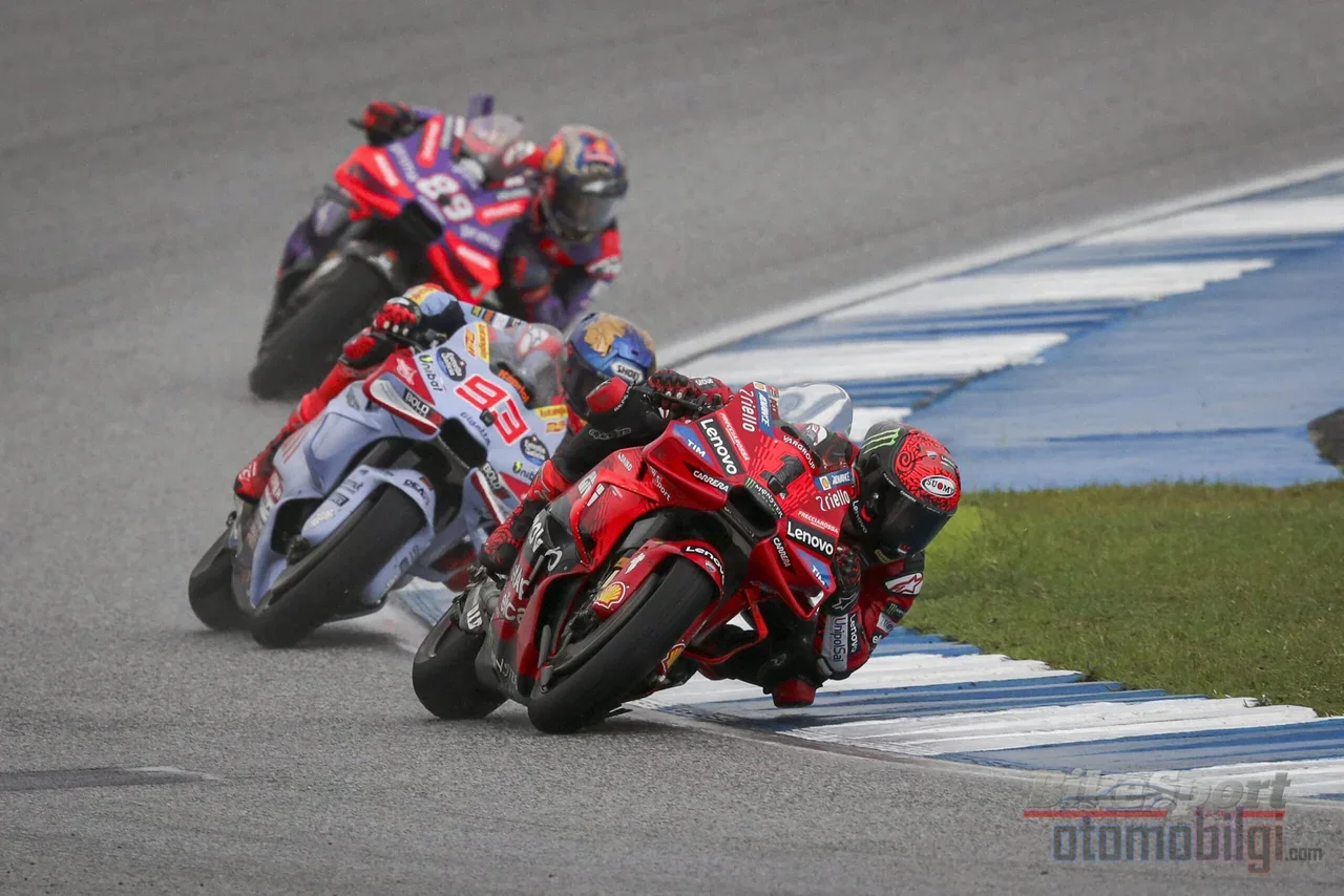 A MotoGP machine leaning into a corner at up to 65 degrees does not fall, because gravity and centrifugal force find perfect balance and the tire has the grip to carry it.