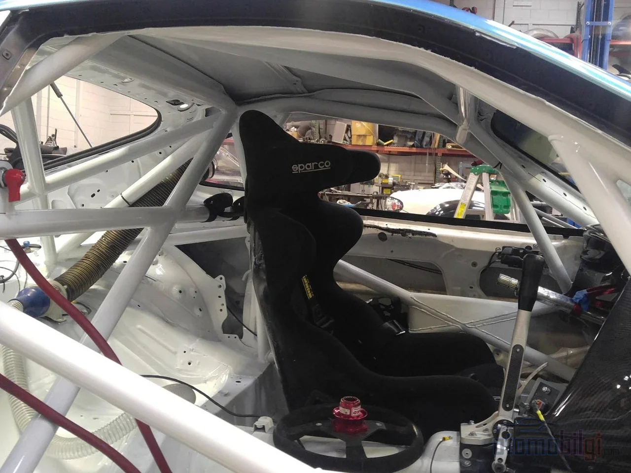 In rallycross, safety is no accident; since 600-horsepower cars will race by bumping into each other, the roll cage, harnesses, and barriers are designed as a single system.