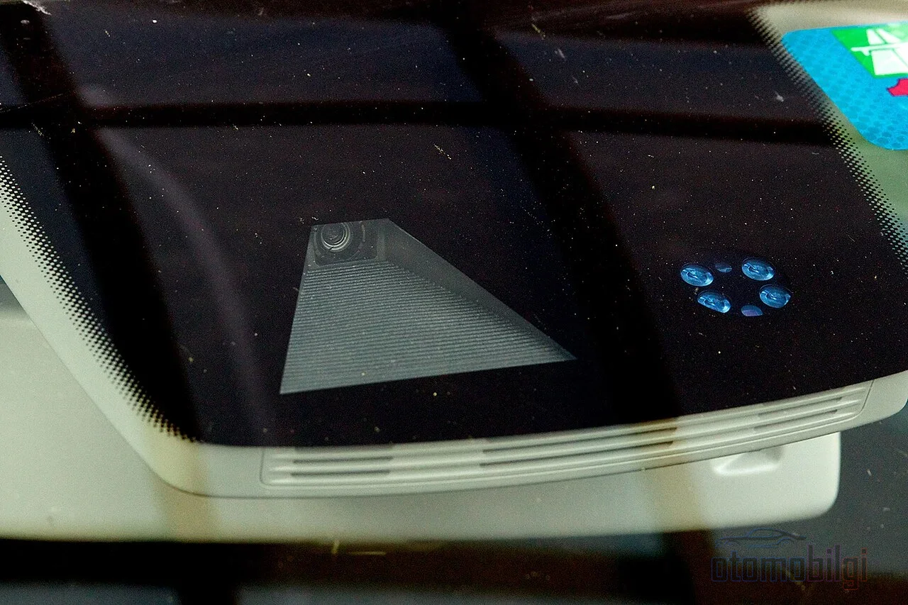 A newly installed windshield reads even the lane warning incorrectly until the camera is realigned; calibration isn't half the job, it's the whole job.